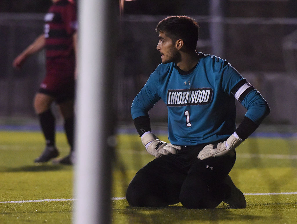 Adrian Mana looks down the field